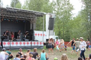 Festival-goers show their enjoyment of the music by dancing in front of the stage